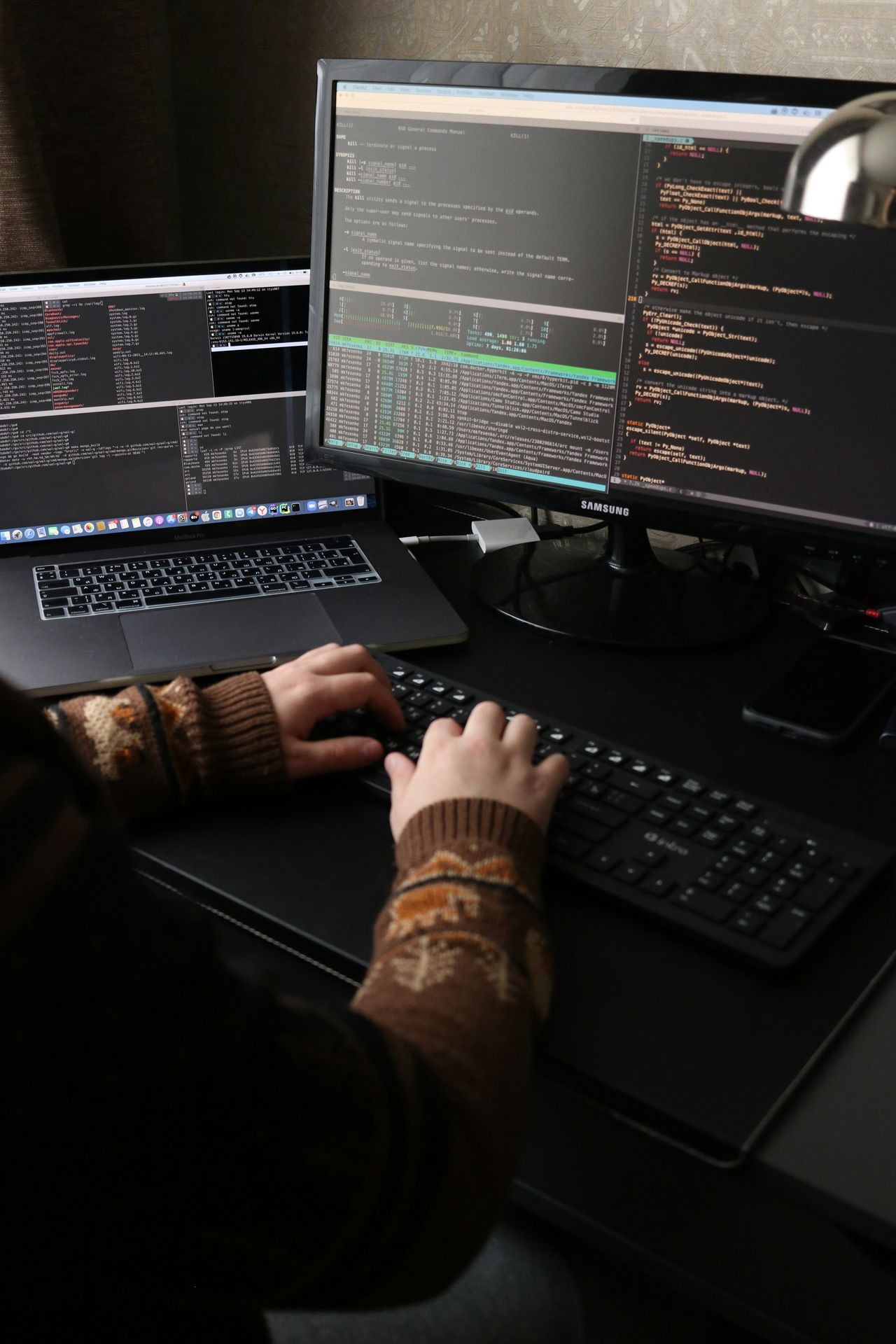 The workspace where Angoer began — a laptop, Django code, and a self-taught developer building something new.